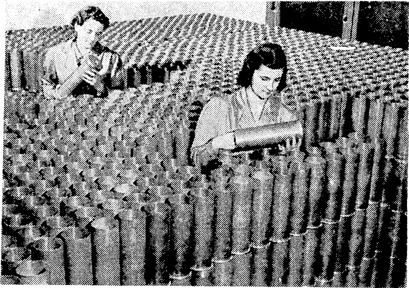 Are we downhearted? It is easy to guess the ansiver of these soldiers of the Maori Battalion, who are amongst the N.Z.E.F. Forces in the Middle East. Each day brings a faster tempo to Canadian war industry, and more women are being absorbed into the country's munitions factories. These girls are inspecting shell cases in one of the large plants. (Evening Post, 10 June 1941)