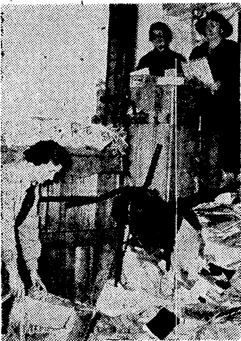 Bagging waste paper at the depot in Lombard Street. (Evening Post, 10 July 1942)
