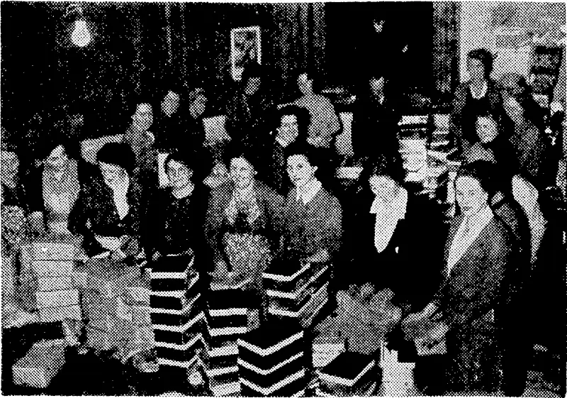 Some of the women volunteers who packed the special Christmas parcels of tobacco in the National Patriotic Fund Board's store in Wellington for New Zealanders serving overseas who are not with any large body of New Zealand Service personnel. (Evening Post, 09 October 1943)