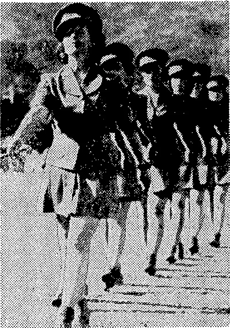 A section of one of the teams taking part in the Hutt Valley Girls' Interhouse Association's marching display at Hutt Recreation Ground last Saturday. (Evening Post, 08 December 1943)