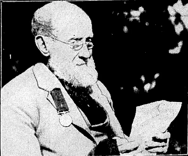 A. K. Kingsford Photo, CORPORAL J. COLTHART, Maori War veteran of the Wanganui Regiment, ivho yesterday celebrated his hundredth birthday at Nelson, He is heic seen reading leljers and telegrams of. congratulations (Evening Post, 26 April 1933)