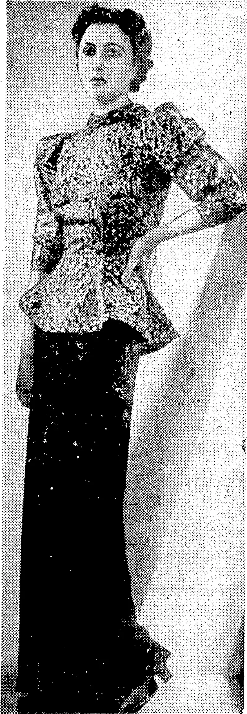 Sport ana General" I'liuto. FOR INFORMAL OCCASIONS. —Novel evening gown in black, ivith gold tunic. It has the new high neckline, full sleeves, and flared basque. (Evening Post, 17 December 1936)