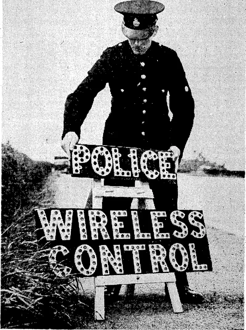 Radio control boxes are being erected between Preston and" Blackpool, in the north of England.' It is expected that by this means traffic officers ivill be able to prevent congestion on one of the very busiest roads in England. A traffic officer is seen placing A warning sign in position near his control box. (Evening Post, 30 July 1938)