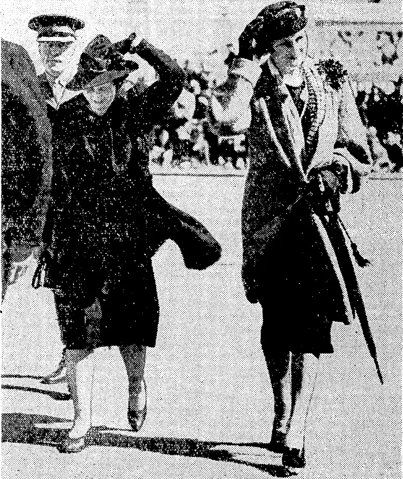 It ivas very windy yesterday ivhen the viceregal parly arrived for the opening of the Centennial Exhibition. Lady Galway (right) ami Mrs Hislop are seen going to their seats huffeted by the wind. (Evening Post, 09 November 1939)