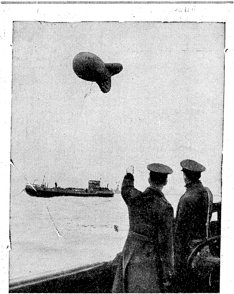 Eeitain's Defence agaikstthe Dive-bomber—A'barrage balloon anchored to a barge off the coasfe.of .-JSngland. (Rodney and Otamatea Times, Waitemata and Kaipara Gazette, 03 July 1940)