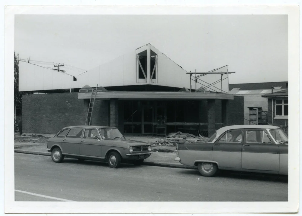 Two cars outside St. Andrew's Church in Balclutha