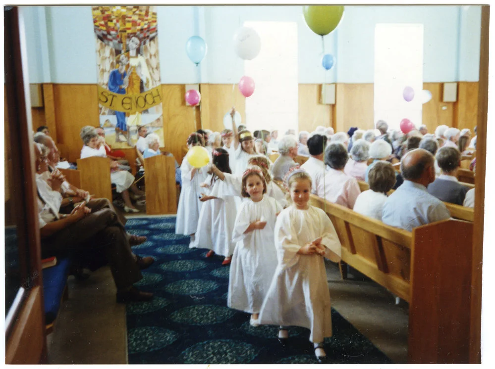 Mellissa Campbell leads the 'angels,' out of St. Enoch's Church, 1990