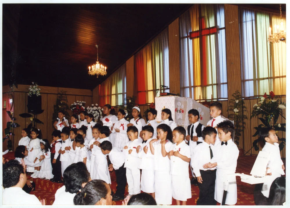 Children perform at Glen Eden Pacific Islanders Church during a White Sunday service, 2002