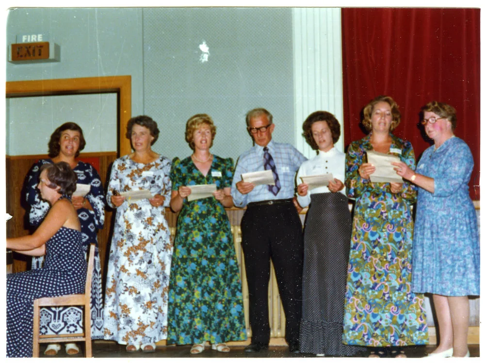 Women and a man belonging to Cromwell Church perform a song, a woman plays the piano