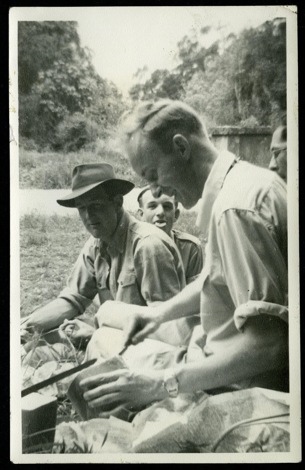 Alan Norton, Don Crabb and Eric Mangin seated outside