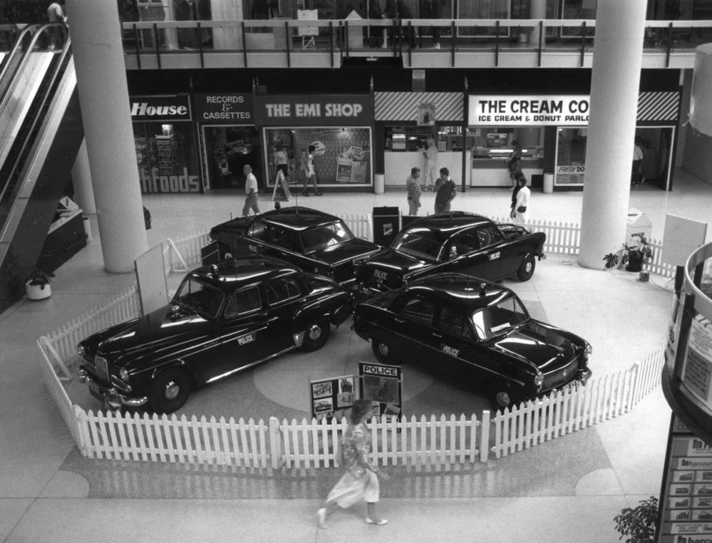 Maidstone Mall display; police cars.