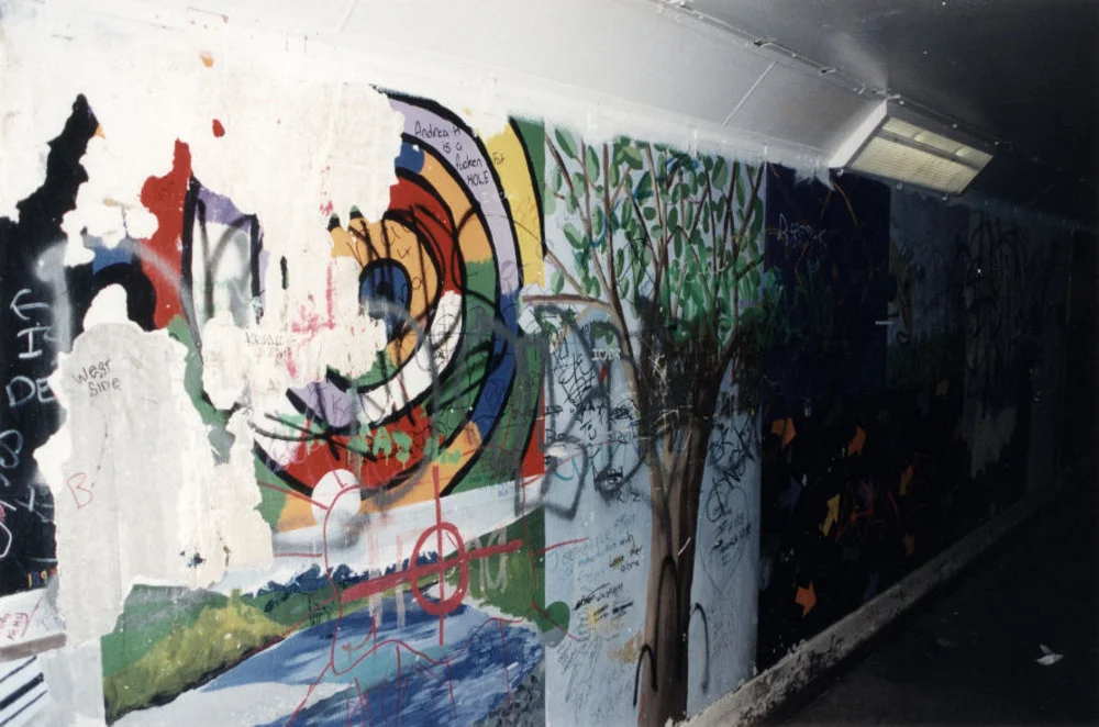 Railway station subway, Upper Hutt; vandalised mural and wall.