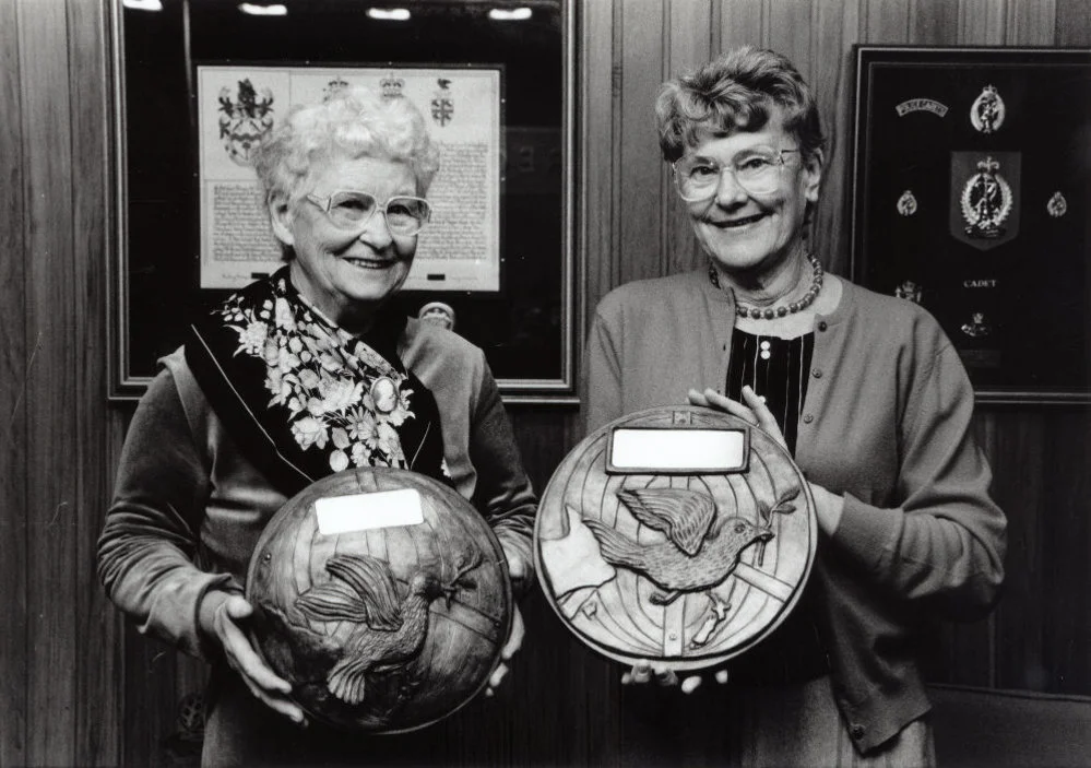 Nuclear-weapon-free city plaques; sculptor Frances Wood, Peace Action president Gwen Johnson.