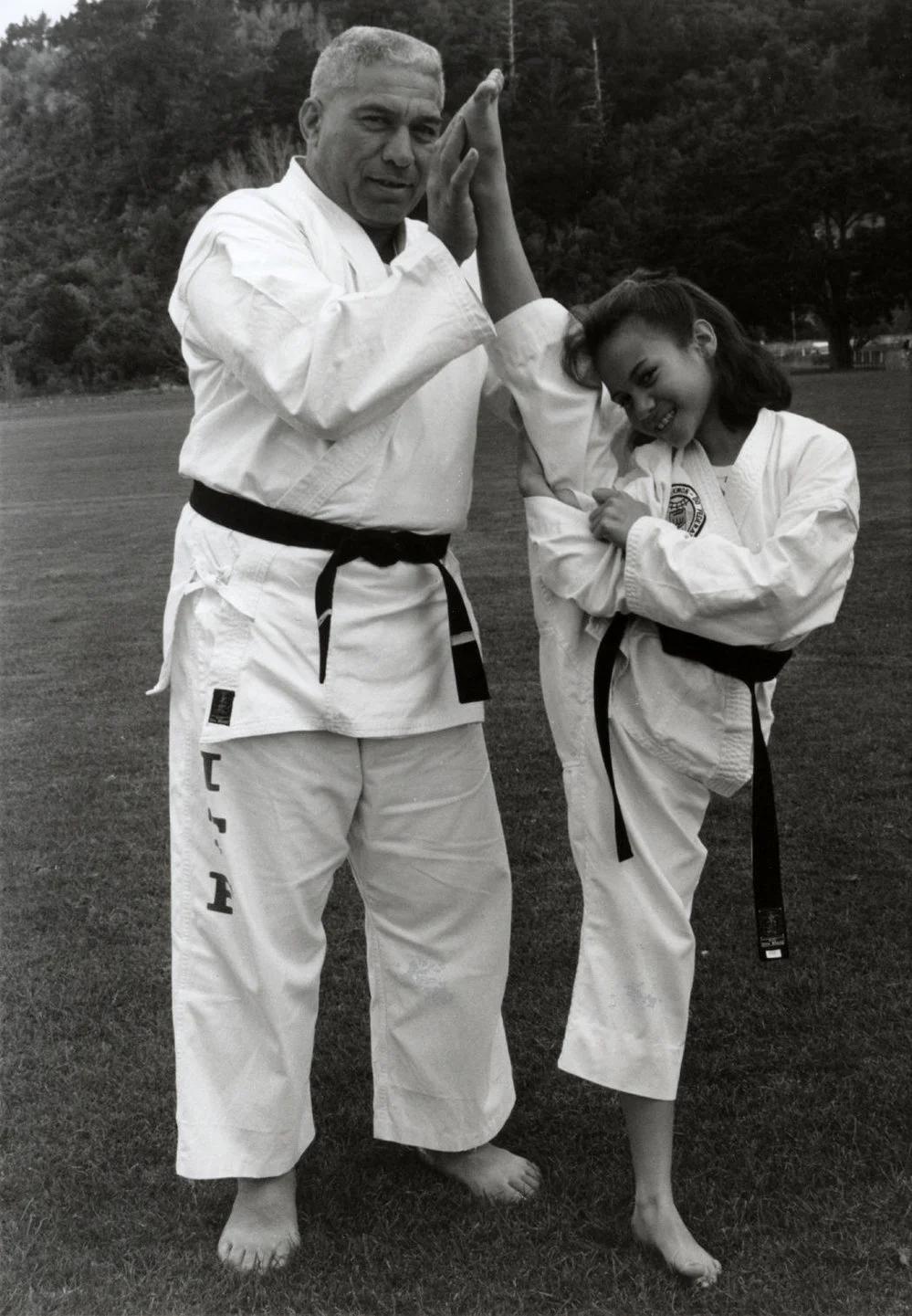 Taekwondo; Rene Nuku, youngest person to pass black belt exam, with her father, Phil.