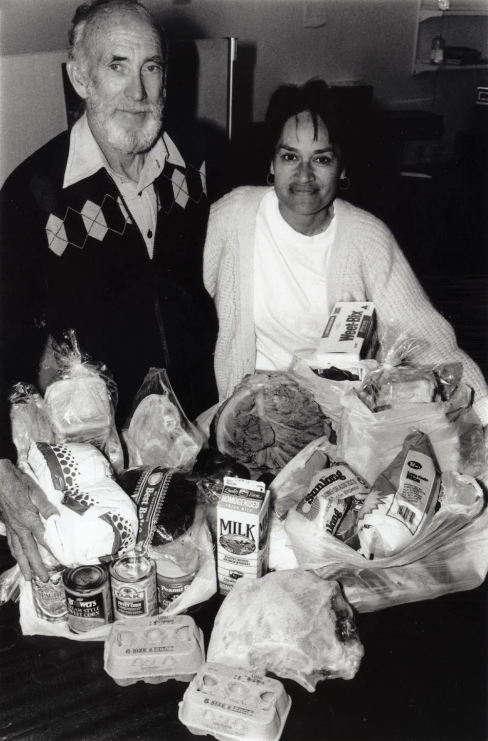 Foodbank; 1000th food parcel; volunteer Rex Aldridge and youth worker Kira Brough.