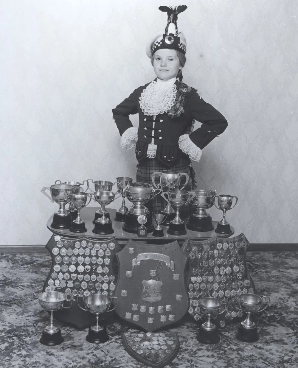 Tracey Watson with Highland dancing trophies. [P3-307-1382]