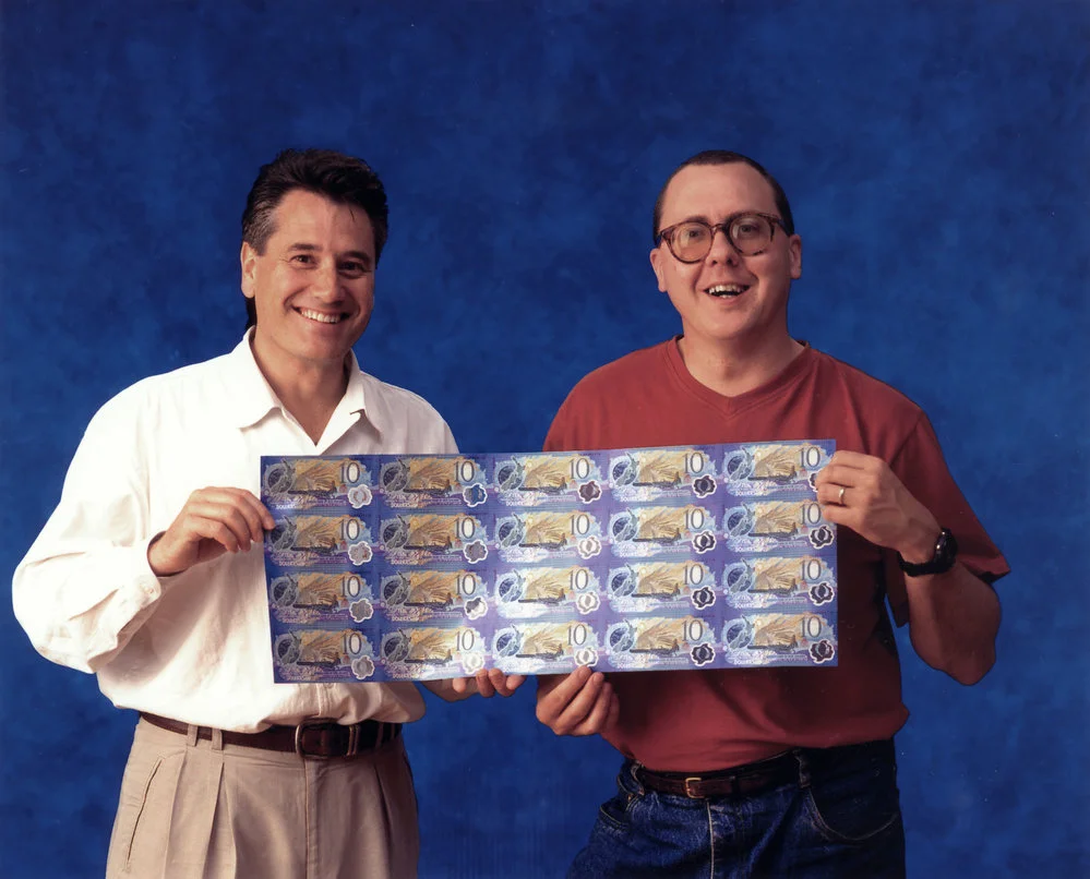 Peter Gray and Ken Wright with millennium $10 notes designed by Ken's Cue Design company