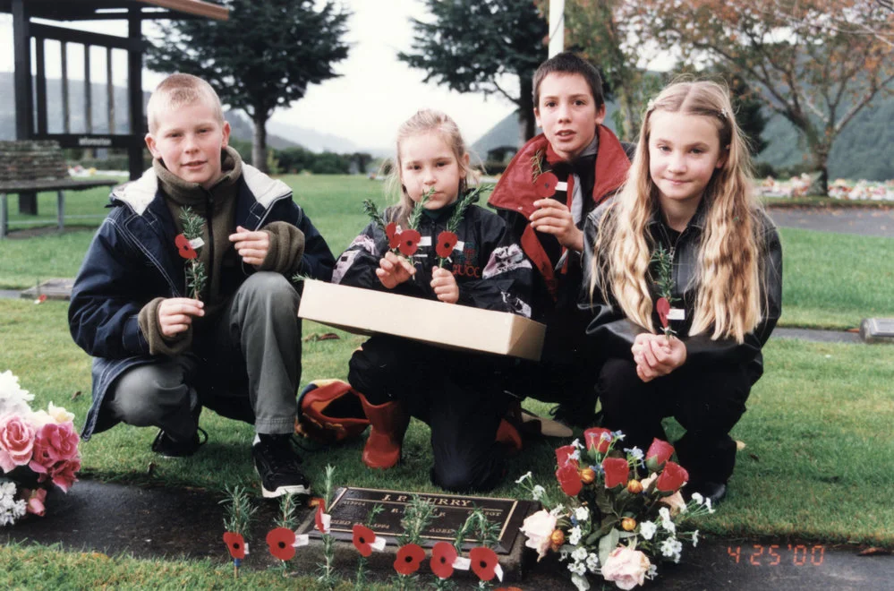 Anzac Day; Nelson, Morgan and Daniel Curry and Kate Sinai at the grave of their grandfather, Jim Curry