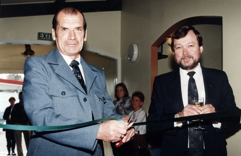 Rimutaka Tavern reopens; Licensing Trust president Tom Jones watches patron Frank Blackler.