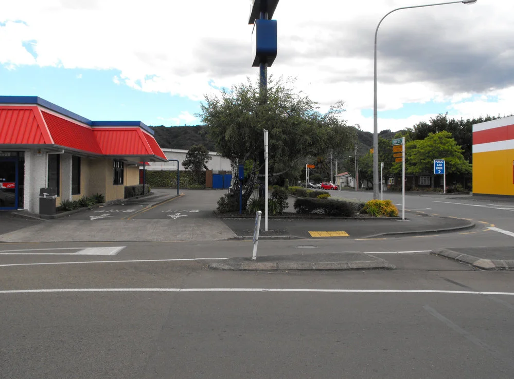 Queen Street, north side; No. 23; KFC car-park and Logan Street