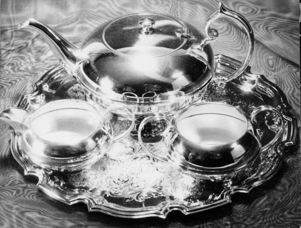 Hazelwoods sales pictures; silver-plated tea pot, milk jug, and sugar basin on tray.