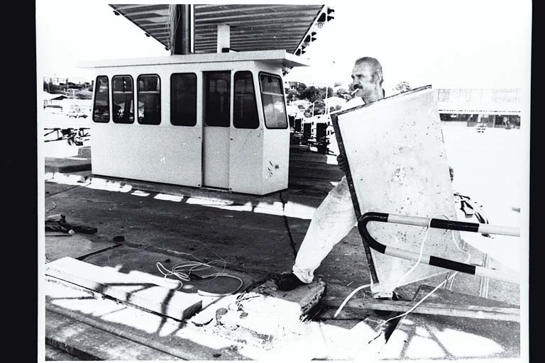 Showing workmen demolishing? the toll booths on the Auckland Harbour Bridge, 1984?