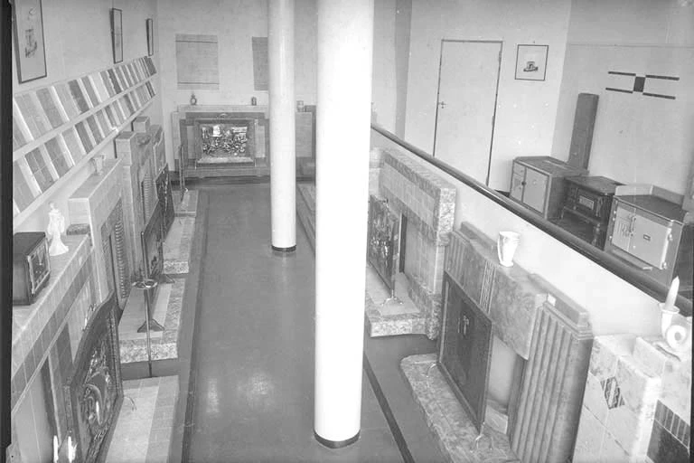 Interior view of John Burns and Company showroom showing fireplaces