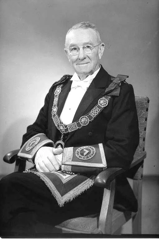 Head and shoulders portrait of Mr Doug Hay, in ceremonial dress