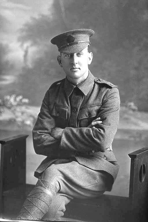 Full portrait of Rifleman Claude Roy Ayling seated. Reg No. 23/59, of the New Zealand Rifle Brigade.