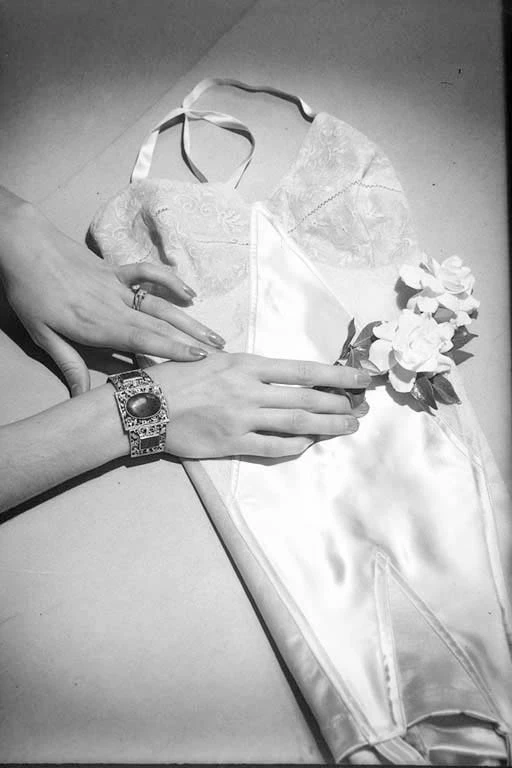 Advertising Berlei underwear, showing a pair of hands wearing rings and a bracelet