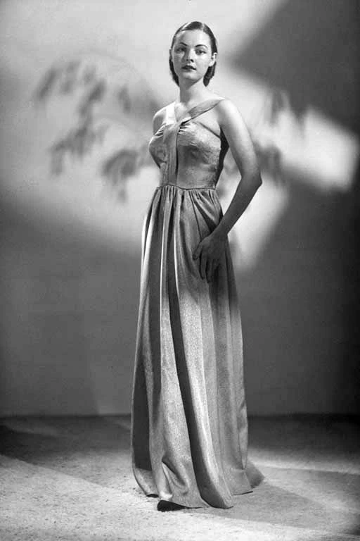 Full length portrait of Ann Thomas modelling for Reslau Frocks