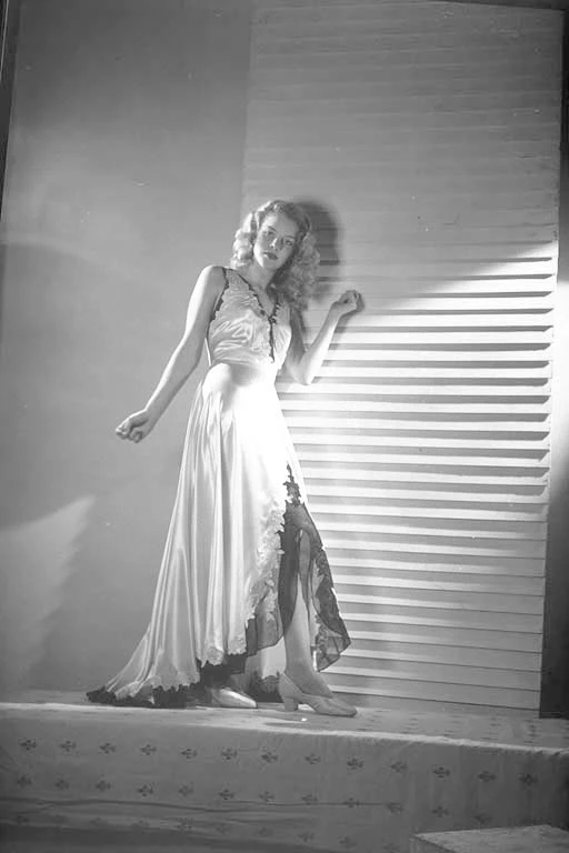 Full length portrait of Miss Sheila McGuire modelling for Silknit