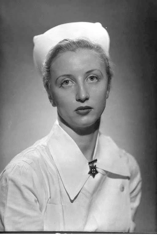Head and shoulders portrait of Miss Winstone in nurses uniform