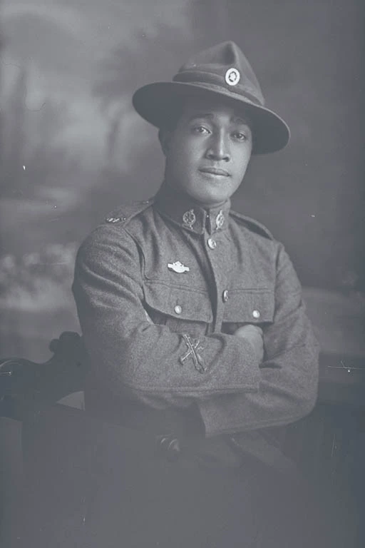 3/4 portrait of Private Florian of the Maori Contingent, New Zealand Maori Pioneer Battalion, wearing a New Zealand Returned Soldiers Association Badge.