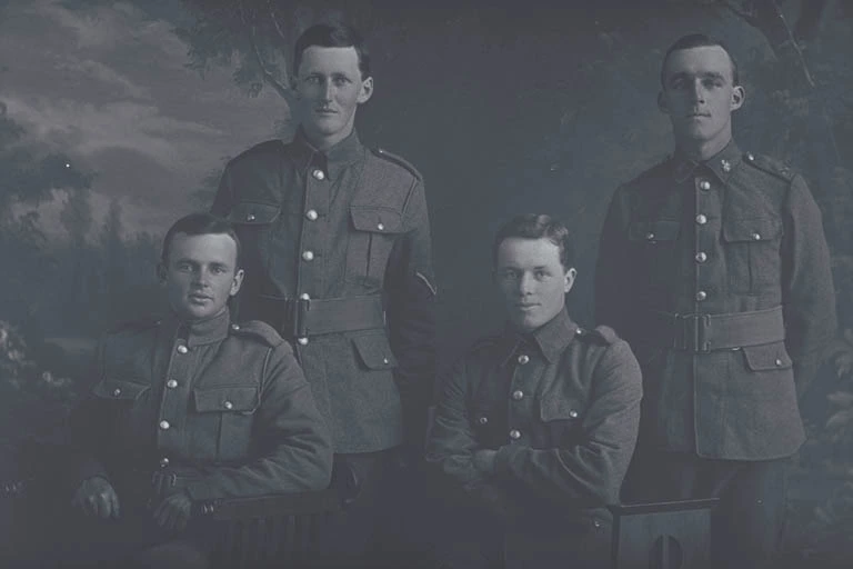 3/4 group portrait of 3 Privates and 1 Lance Corporal, including on the right, Private (Corporal in the nominal roll) Eric Tonks, Reg No 24/315, of the Samoan Advance and the 2nd Battalion New Zealand Rifle Brigade, New Zealand Signal Corps.