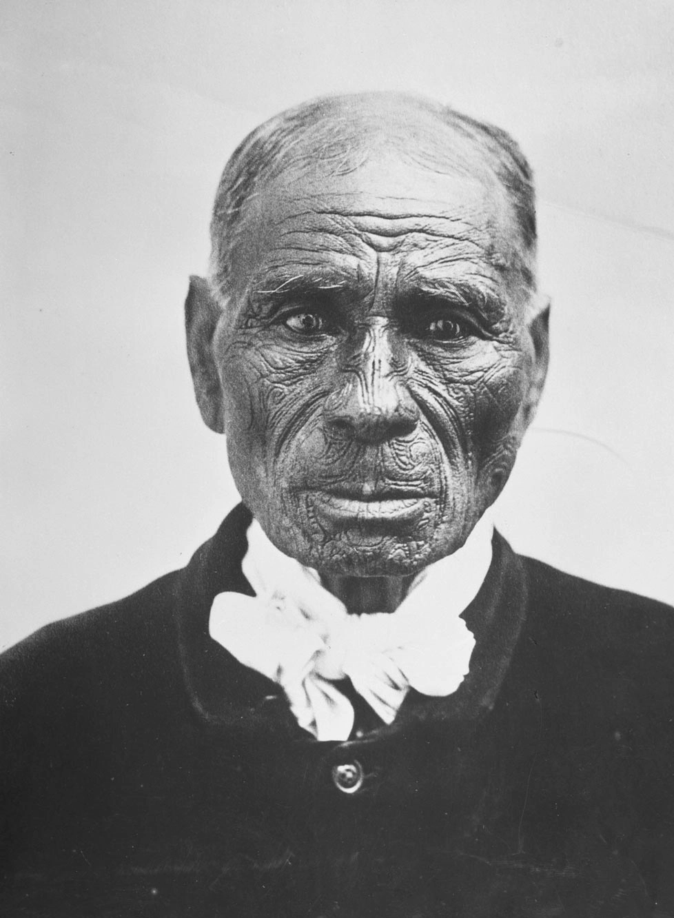 Unidentified elderly Maori man with moko