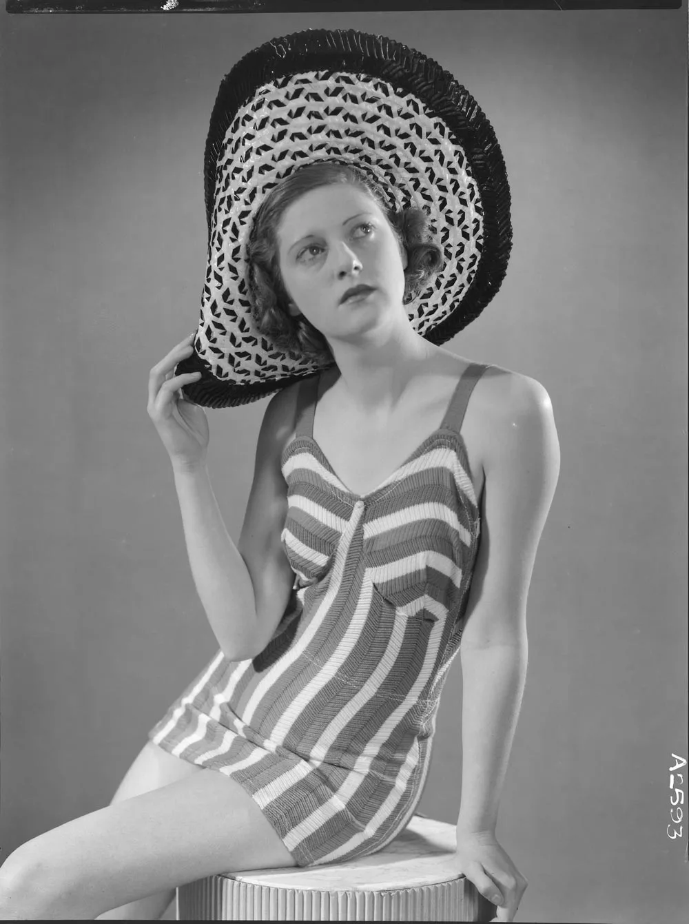 Full length portrait of a model for New Zealand Knitted Wear 1940s