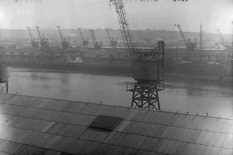 Looking south west from Queens Wharf, roof of goods sheds....