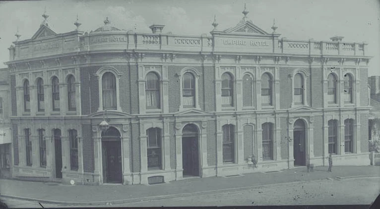 Showing the Empire Hotel on the corner of...