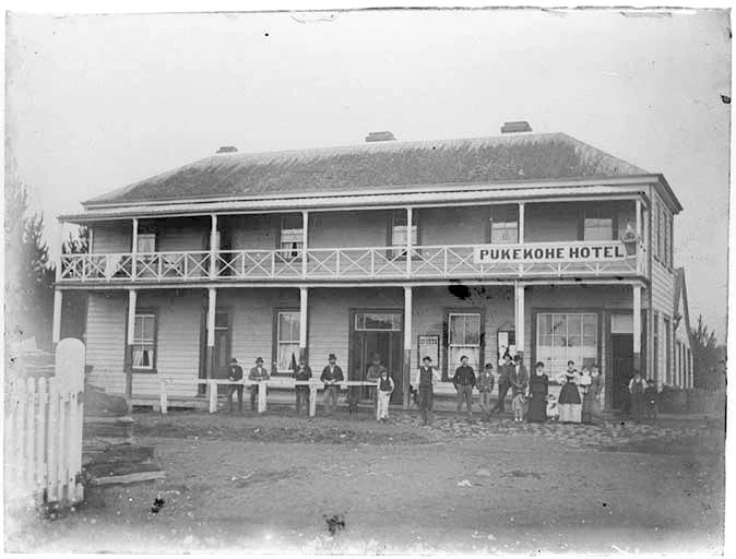 Showing the Pukekohe Hotel, with men...