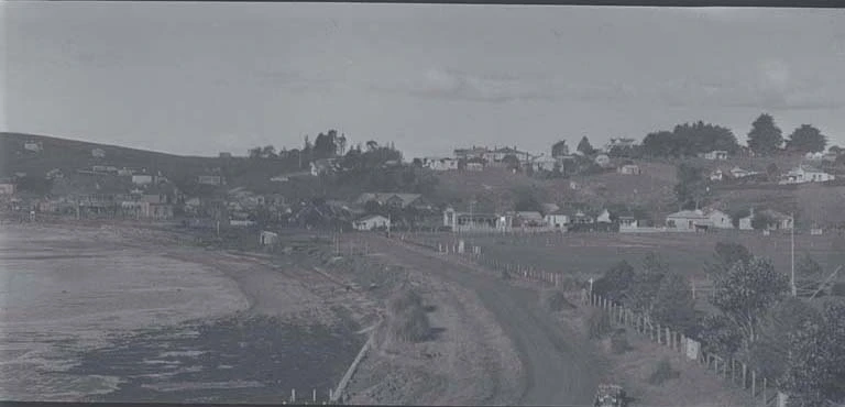 Looking east along road (now Tamaki Drive) at St Heliers Bay,....