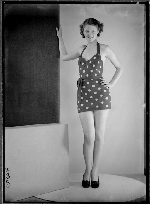 Showing a model wearing a spotted bathing suit 1940