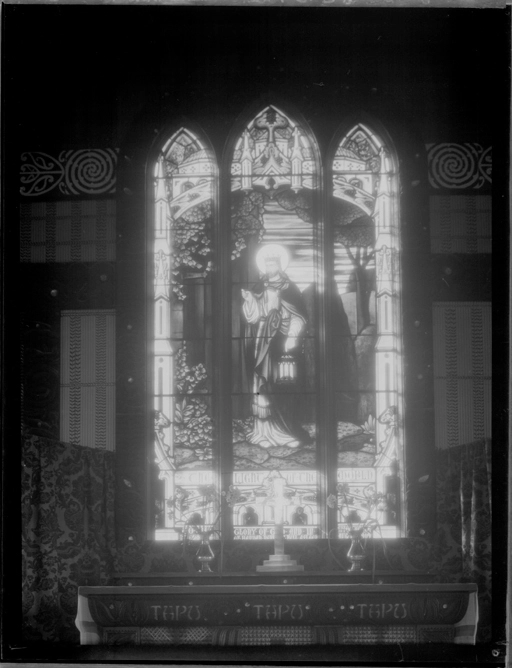 Showing the altar and stained glass windows at St Faiths Church, Ohinemutu