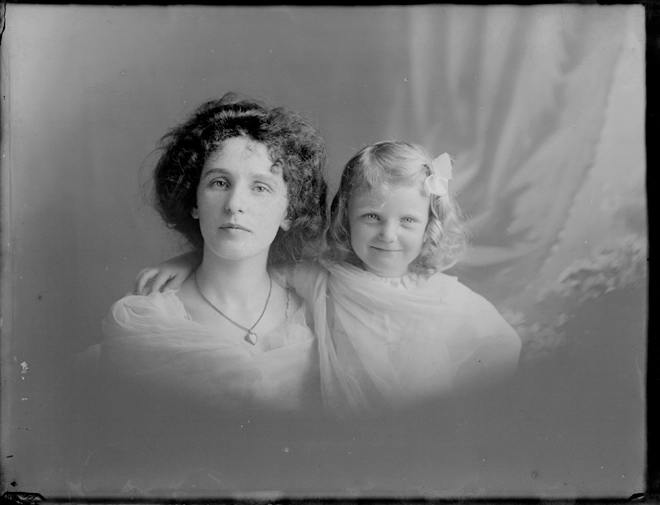 1/2 length group portrait of a woman and a young girl, the....