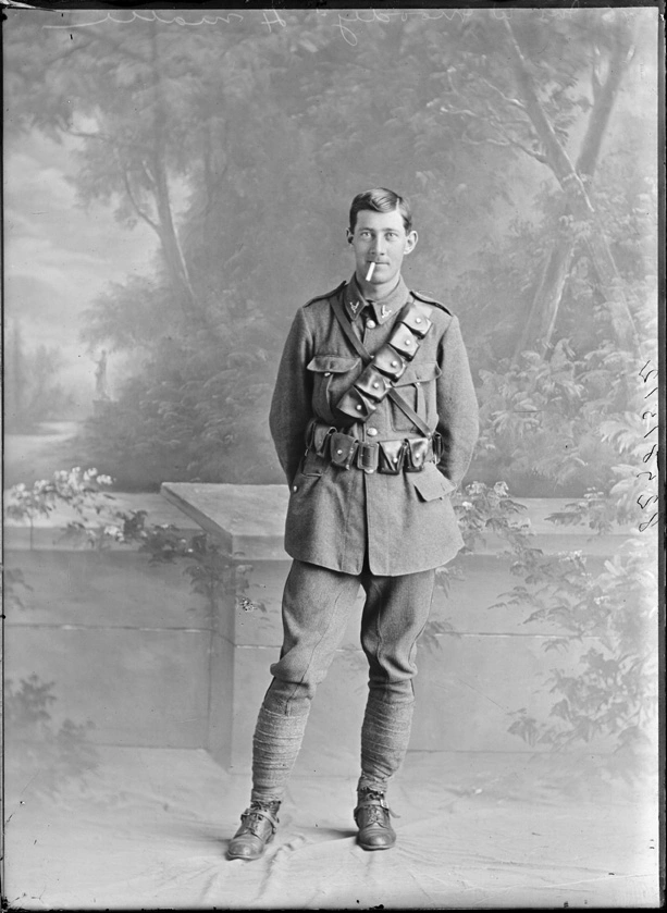 Full length portrait of Trooper William Moody, Reg No 13/410, of the 4th (Waikato) Mounted Rifles, Auckland Mounted Rifles, New Zealand Mounted Rifles, Main Body, smoking a cigar. Killed in action at Gallipoli on the 19th May 1915.