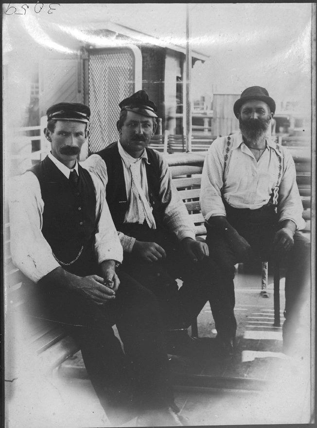 Portrait of W Jenkins, Captain George Leaity, Joe Fleming on a ferry