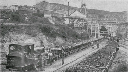 Hoppers at number 1 shaft, Waihi G M Company with the open cut...