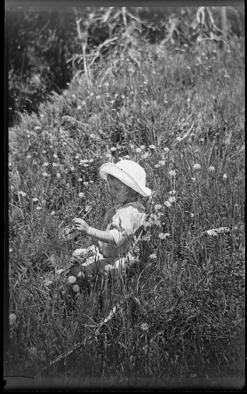 Girl seated in the grass...