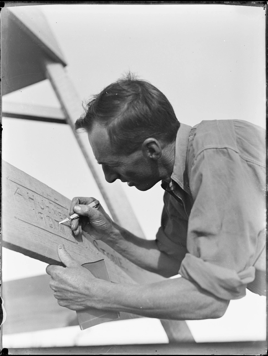 Bert Jones carving his name in trig, Whatipu