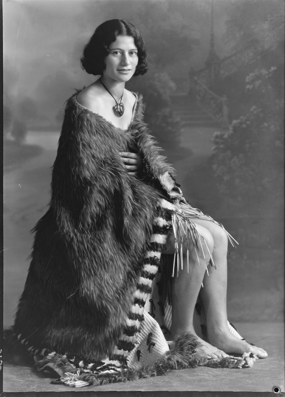 Portrait of a Maori woman in a feather cloak